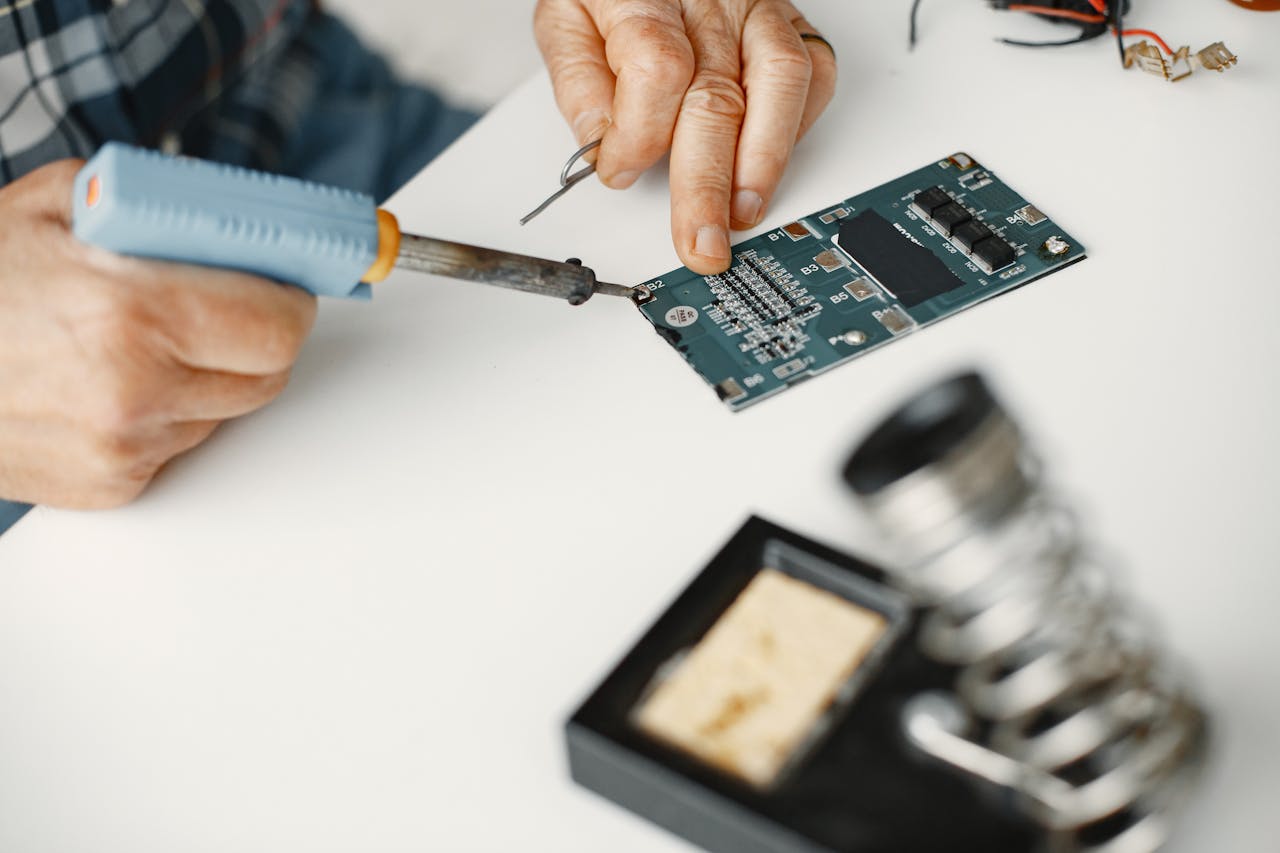 digital-01 Detailed view of soldering work on a circuit board, highlighting precision in electronics repair.